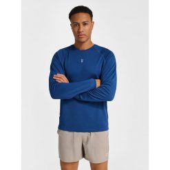 Koszulka z długim rękawem Hummel Pulse Performance. Niebieskie koszulki sportowe męskie Hummel, bez wzorów, bez ramiączek, na fitness i siłownię. Za 175.00 zł.