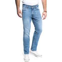 MUSTANG Washington 1011343 5000 202. Niebieskie spodnie materiałowe męskie Mustang, bez wzorów, z denimu. Za 209.99 zł.