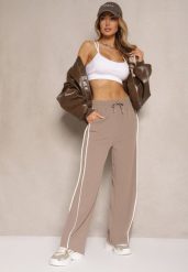 Brązowe Szerokie Spodnie Dresowe High Waist Zdobione Lampasami Sopaline. Brązowe spodnie dresowe damskie Renee, z aplikacjami, z dresówki, eleganckie, z podwyższonym stanem, trekkingowe. Za 49.99 zł.