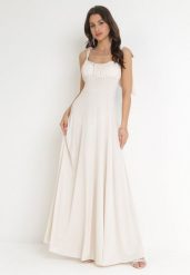 Beżowa Rozkloszowana Sukienka Maxi z Wiązanymi Ramiączkami Lisija. Brązowe sukienki damskie Born2be, na wesele, m, bez wzorów, eleganckie, bez kołnierzyka, bez ramiączek, maxi, rozkloszowane. Za 149.99 zł.
