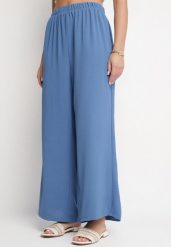 Niebieskie Spodnie Palazzo o Szerokim Kroju z Wysokim Stanem Aravenna. Niebieskie spodnie materiałowe damskie Born2be, z aplikacjami, z jeansu, eleganckie, z podwyższonym stanem. Za 34.99 zł.