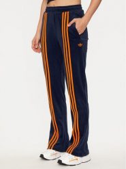 Adidas Spodnie dresowe Velour JN8290 Granatowy Regular Fit. Niebieskie spodnie dresowe damskie Adidas, bez wzorów, z dresówki. Za 299.99 zł.
