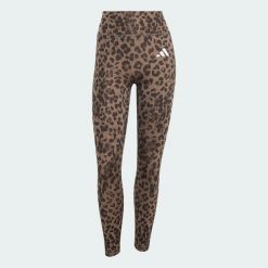 Legginsy Optime Essentials 3-Stripes Leopard 7/8. Brązowe legginsy damskie Adidas, bez wzorów, z elastanu. Za 219.00 zł.