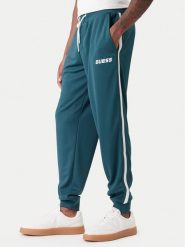 Guess Spodnie dresowe Z6RB13 KD482 Zielony Regular Fit. Zielone spodnie sportowe męskie Guess, m, z aplikacjami, z dresówki. Za 349.99 zł.