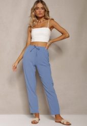 Niebieskie Spodnie na Gumce z Troczkiem w Pasie i Zwężanymi Nogawkami Starima. Niebieskie spodnie materiałowe damskie Renee, bez wzorów, z jeansu, eleganckie. Za 49.99 zł.