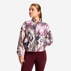 Bluza sportowa damska Domyos. Fioletowe bluzy damskie DOMYOS, l, bez wzorów, z materiału, sportowe, bez ramiączek, bez kaptura. Za 99.99 zł.