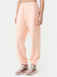 Adidas Spodnie dresowe Essentials JD1525 Różowy Loose Fit. Czerwone spodnie dresowe damskie Adidas, bez wzorów, z bawełny. Za 159.99 zł.