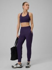 4F Spodnie treningowe szybkoschnące damskie - fioletowe M. Fioletowe spodnie dresowe damskie 4F, bez wzorów, na fitness i siłownię. Za 179.99 zł.