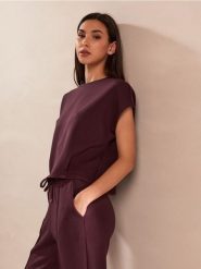 Bluza bez rękawów soft touch z dodatkiem wiskozy - czerwony. Czerwone bluzy damskie Sinsay, l, bez wzorów, z dzianiny, sportowe, bez ramiączek, bez kaptura. Za 39.99 zł.