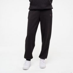 Spodnie fitness damskie Puma. Czarne spodnie materiałowe damskie Puma, bez wzorów, z bawełny, sportowe. Za 129.99 zł.