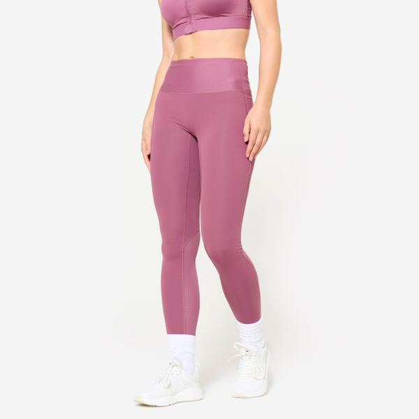 Legginsy fitness damskie Domyos. Fioletowe legginsy damskie DOMYOS, bez wzorów, z materiału. W wyprzedaży za 79.99 zł.