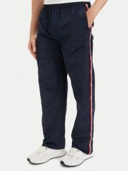 Tommy Jeans Spodnie dresowe DM0DM23123 Granatowy Relaxed Fit. Niebieskie spodnie sportowe męskie Tommy Jeans, m, bez wzorów, z dresówki. Za 489.99 zł.