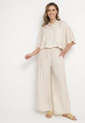 Beżowy Wiskozowy Komplet Oversize Koszula z Krótkim Rękawem i Spodnie Dovilissea. Brązowe koszule damskie Born2be, m, bez wzorów, z wiskozy, eleganckie, bez kołnierzyka, bez ramiączek. Za 119.99 zł.