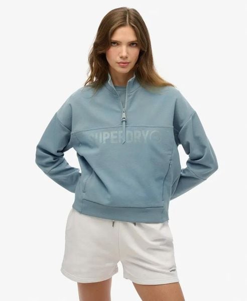 Superdry Bluza Active Tech Logo Relaxed Half Zip Luźny krój. Niebieskie bluzy damskie Superdry, bez wzorów, z bawełny, sportowe, bez ramiączek, bez kaptura. Za 314.40 zł.