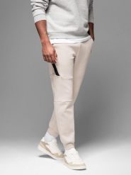 Męskie spodnie dresowe ze ściągaczami i ozdobnym zamkiem – piaskowe V6. Spodnie sportowe męskie Ombre Clothing, m, bez wzorów, z bawełny. W wyprzedaży za 89.99 zł.