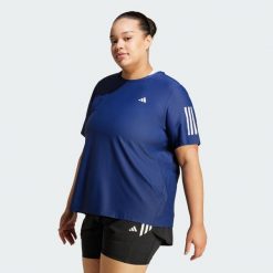 Koszulka Own The Run (Plus Size). Białe bluzki damskie Adidas, plus size, bez wzorów, z materiału, sportowe, bez kołnierzyka, plus size, bez ramiączek. W wyprzedaży za 127.20 zł.