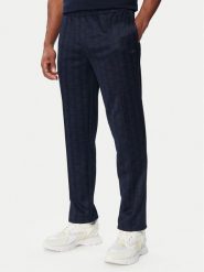 Lacoste Spodnie dresowe XH0197 Granatowy Regular Fit. Niebieskie spodnie sportowe męskie Lacoste, m, bez wzorów, z dresówki. Za 769.99 zł.