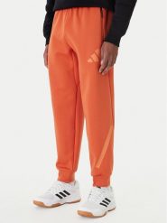 Adidas Spodnie dresowe Z.N.E. KE4686 Pomarańczowy Regular Fit. Brązowe spodnie sportowe męskie Adidas, m, bez wzorów, z bawełny. Za 379.99 zł.