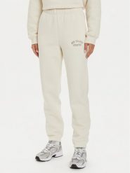 New Balance Spodnie dresowe WP43500 Beżowy Relaxed Fit. Brązowe spodnie dresowe damskie New Balance, bez wzorów, z bawełny. Za 209.99 zł.