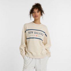 Bluza damska New Balance WT51923LIN – beżowa. Brązowe bluzy damskie New Balance, xl, z aplikacjami, z bawełny, klasyczne, bez ramiączek, bez kaptura. Za 249.99 zł.