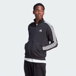 Bluza Essentials Fleece 3-Stripes 1/4-Zip. Czarne bluzy męskie Adidas, s, bez wzorów, z materiału, klasyczne, bez ramiączek, bez kaptura. Za 223.99 zł.