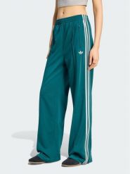 Adidas Spodnie dresowe Firebird Loose Tracksuit KS4672 Turkusowy Loose Fit. Niebieskie spodnie dresowe damskie Adidas, bez wzorów, z dresówki. Za 298.99 zł.