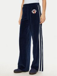 Tommy Jeans Spodnie dresowe Velvet DW0DW20542 Niebieski Regular Fit. Niebieskie spodnie dresowe damskie Tommy Jeans, bez wzorów, z bawełny. Za 299.99 zł.