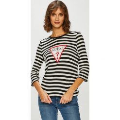 Guess Jeans - Bluzka. Białe bluzki damskie Guess Jeans, l, z aplikacjami, z dzianiny, casualowe, bez kołnierzyka, bez ramiączek. W wyprzedaży za 159.90 zł.