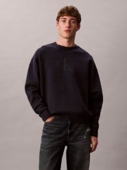 Calvin Klein Jeans sweter z dzianiny Mężczyźni niebieski, M. Niebieskie swetry męskie Calvin Klein Jeans, m, bez wzorów, z dzianiny, eleganckie, bez kołnierzyka, bez ramiączek. Za 379.95 zł.
