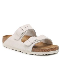 Klapki Birkenstock. Brązowe klapki damskie Birkenstock, bez wzorów, bez obcasa, bez zapięcia. Za 599.99 zł.