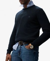 Superdry Essentials Cotton Jumper – sweter bawełniany, krój relaxed. Niebieskie swetry męskie Superdry, uniwersalny, bez wzorów, z bawełny, bez kołnierzyka, bez ramiączek. Za 296.85 zł.