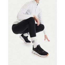 Sneakersy Reebok. Czarne obuwie sportowe damskie Reebok, bez wzorów, bez zapięcia, do biegania. Za 369.99 zł.