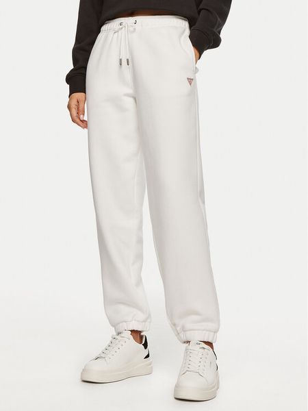 Guess Jeans Spodnie dresowe W4YB33 KC811 Biały Regular Fit. Białe spodnie dresowe damskie Guess Jeans, z aplikacjami, z bawełny. Za 179.99 zł.
