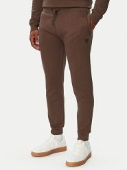 Guess Spodnie dresowe Z2YB22 K9V31 Brązowy Regular Fit. Brązowe spodnie sportowe męskie Guess, m, z aplikacjami, z bawełny. Za 294.99 zł.