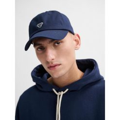 Czapka baseballowa Hummel. Niebieskie czapki damskie Hummel, na lato, bez wzorów, z bawełny, sportowe. Za 157.00 zł.