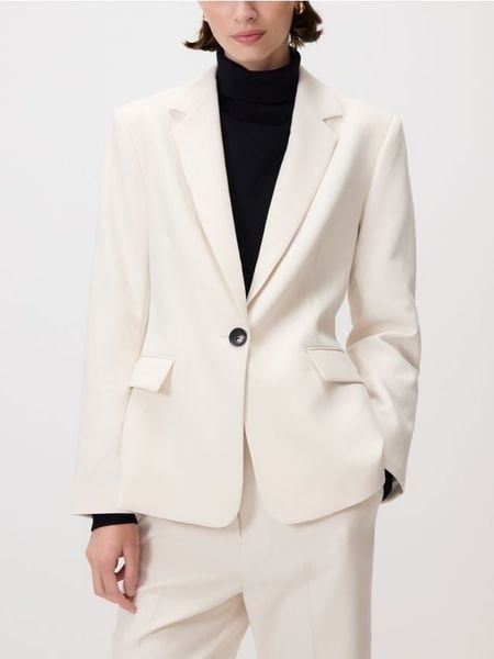 Jednorzędowa marynarka - złamana biel. Marynarki i żakiety damskie Reserved, bez wzorów, z tkaniny, bez kołnierzyka, bez ramiączek. W wyprzedaży za 119.99 zł.