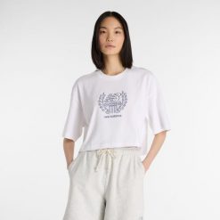 Koszulka damska New Balance WT51935WT – biała. Białe bluzki damskie New Balance, xl, bez wzorów, z bawełny, bez kołnierzyka, bez ramiączek. Za 129.99 zł.