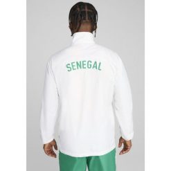 Męska kurtka przedmeczowa Senegal 2025 PUMA White Sport Green. Białe kurtki sportowe męskie Puma, l, bez wzorów, bez kaptura. Za 399.00 zł.