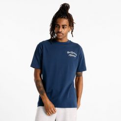 Koszulka męska New Balance MT43556NNY – granatowa. Niebieskie koszulki sportowe męskie New Balance, m, bez wzorów, z dresówki, bez ramiączek. Za 99.99 zł.