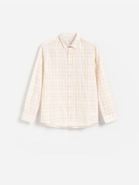 Bawełniana koszula regular fit - żółty. Żółte koszule męskie Reserved, l, bez wzorów, z bawełny, bez kołnierzyka, bez ramiączek. W wyprzedaży za 39.99 zł.