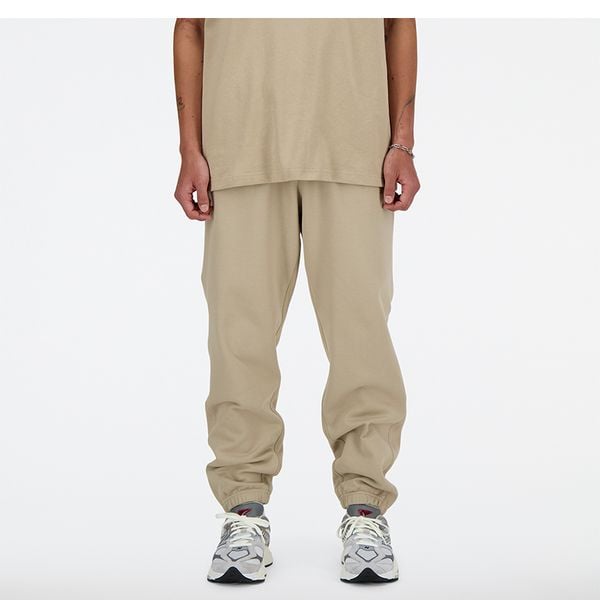Spodnie męskie New Balance MP41508SOT – beżowe. Brązowe spodnie sportowe męskie New Balance, m, bez wzorów, z bawełny. Za 199.99 zł.