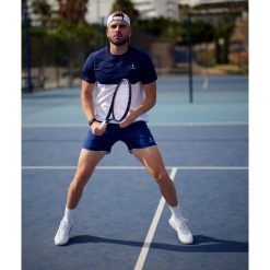 Koszulka sportowa męska Performance. Białe koszulki sportowe męskie NORDICDOTS, l, bez wzorów, z elastanu, bez ramiączek. Za 230.00 zł.