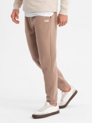 Klasyczne spodnie dresowe unisex ze ściągaczami brązowe V16 OU-PSBC-0100 XS/S. Brązowe spodnie sportowe męskie Ombre, m, bez wzorów, z dresówki. Za 302.57 zł.
