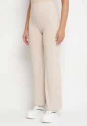 Beżowe Legginsy Dzwony z Wysokim Stanem i Szeroką Gumką w Talii Idoreia. Brązowe legginsy damskie Born2be, bez wzorów, z jeansu. Za 49.99 zł.
