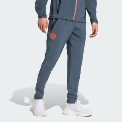 FC Bayern Tiro 25 Competition Vis Tech Travel Pants. Brązowe spodnie sportowe męskie Adidas, l, bez wzorów, z dresówki, do piłki nożnej. Za 329.00 zł.