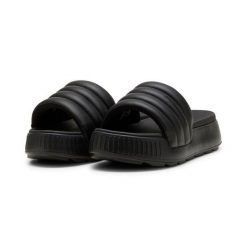 Puma Klapki Karmen Slide Puffy 39539901. Czarne klapki damskie Puma, bez wzorów, z materiału, bez obcasa, bez zapięcia. Za 159.00 zł.