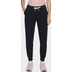 Spodnie dresowe damskie SPDD200 - ciemny granat. Spodnie dresowe damskie 4F, bez wzorów, z dresówki, climacool (adidas). Za 119.99 zł.