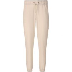 Damskie spodnie dresowe Athlecia Austberg. Brązowe spodnie dresowe damskie Endurance, bez wzorów, z dresówki, sportowe. Za 193.50 zł.