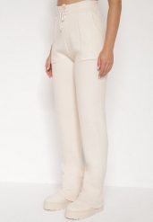 Beżowe Sweterkowe Spodnie z Wełną z Ozdobnymi Kieszeniami Monilana. Brązowe spodnie materiałowe damskie Born2be, bez wzorów, z jeansu. Za 69.99 zł.