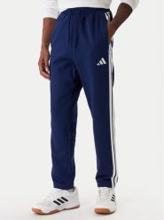 Adidas Spodnie dresowe Essentials 3-Stripes JE6334 Granatowy Regular Fit. Niebieskie spodnie sportowe męskie Adidas, m, bez wzorów, z bawełny. Za 219.99 zł.